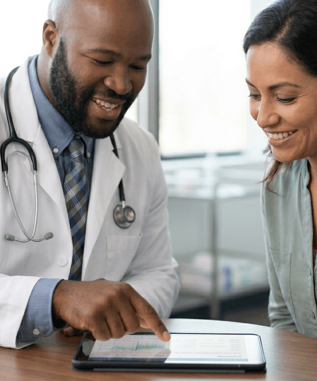 Tony consulting with a patient in the Corva Medical clinic